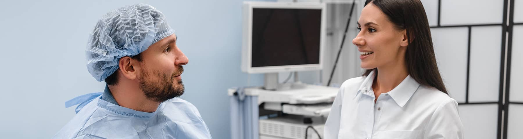 Physician consulting with a patient in a clinical exam room